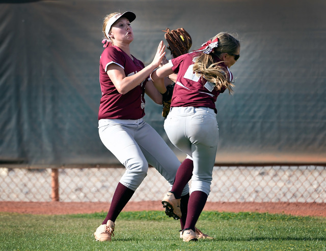 Faith Lutheran’s Mosie Foley, left, and Breanna Hemphill collide in the outfield durin ...