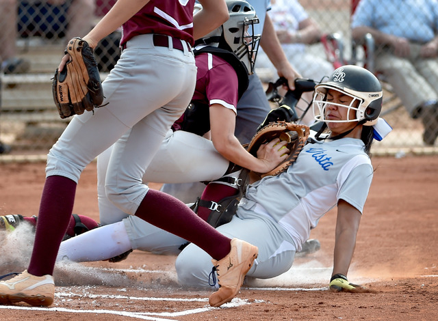 Sierra Vista’s Kalei Watkins is tagged out as she slides home against Faith Lutheran c ...
