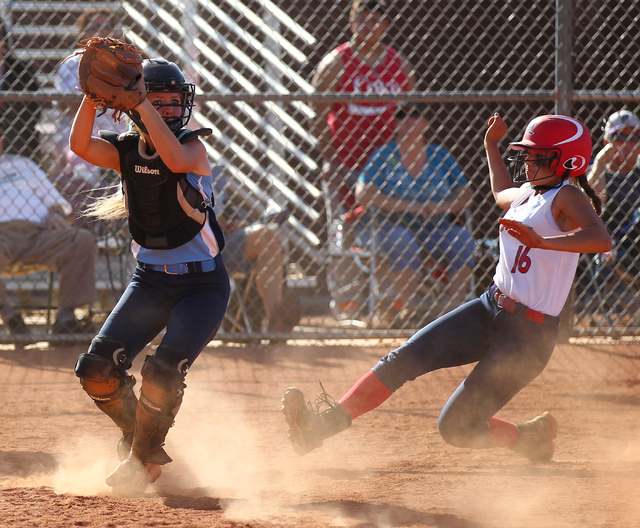 Foothill catcher Hannah Stevens (15) looks to throw to complete a double play after forcing ...
