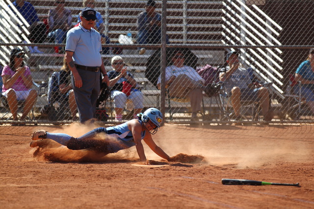 Foothill’s Alexia Campbell (9) slides into home plate while playing against Liberty at ...