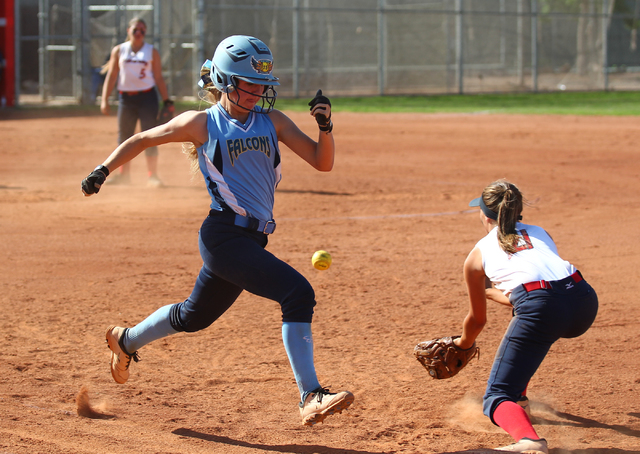 Foothill’s Hannah Stevens legs out a single ahead of the throw to Liberty first baseman Ky ...