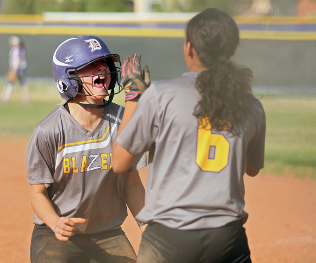 Durango catcher Mykayla Cutone, left, celebrates with Alia Armstrong upon returning to the d ...