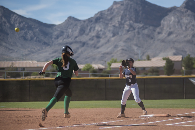 Shadow Ridge’s Samantha Milanovich (5) receives the ball for an out at first against P ...