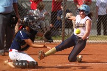Foothill’s Kelsey McFarland slides safely into home plate as Coronado’s Basia Qu ...