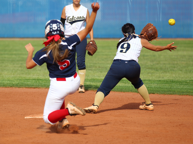 Foothill’s Alexia Campbell (9) reaches for a throw as Coronado’s Nicole Hardy (5 ...