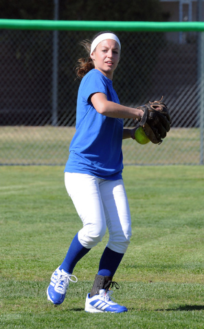 Green Valley girls softball center fielder Maggie Manwarren throws the ball back to the infi ...