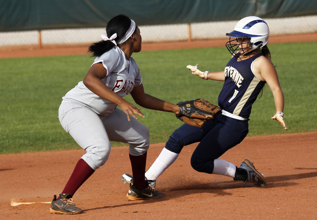 Faith Lutheran shortstop Cheyenne Kidd (8) tags out Cheyenne’s Kylie Clark (1) trying ...