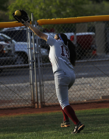 Faith Lutheran’s Vanessa Valdez (19) makes a running catch in the outfield to record t ...