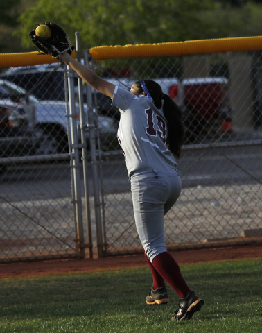 Faith Lutheran’s Vanessa Valdez (19) makes a running catch in the outfield to record t ...