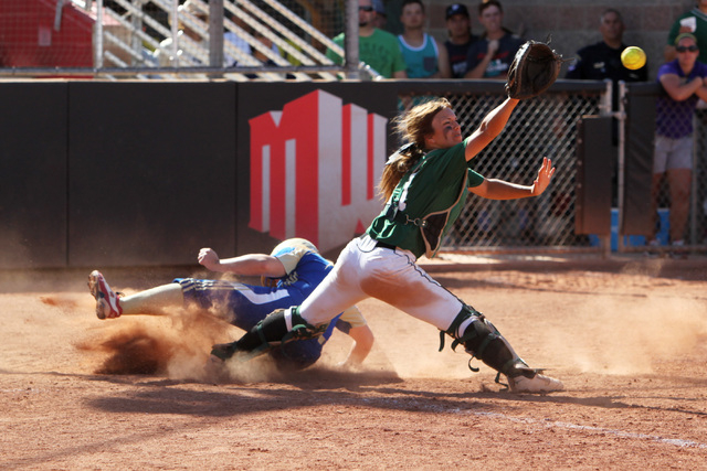 Reed’s Ryia Grant slides into home for the winning run as Palo Verde catcher Kiley Har ...