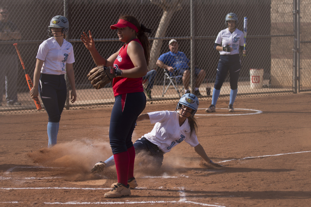Foothill’s Jordan Corn slides into home against Liberty during a softball game at Libe ...