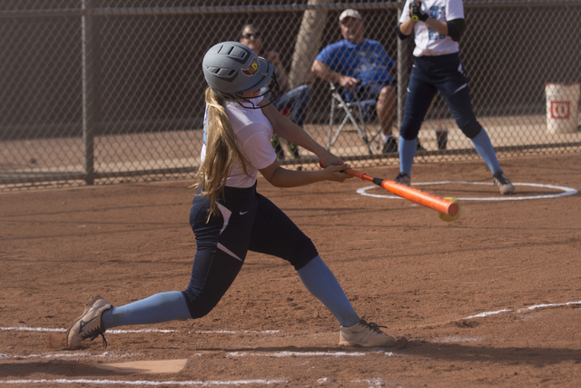 Foothill’s Haliegh Olive gets a hit against Liberty during a softball game at Liberty ...