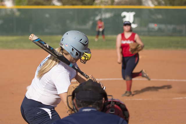 Foothill’s Daryan Meade is hit by a pitch thrown by Liberty’s Brea Alvarez durin ...