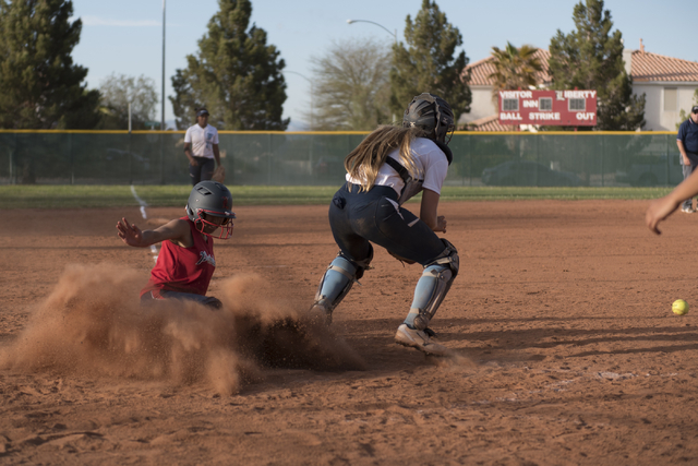 Liberty’s Shaena Kapanui slides into home plate during a softball game against Foothil ...