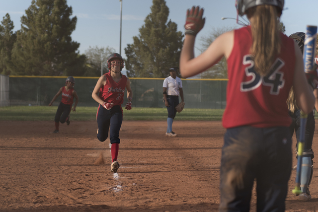 Liberty’s Kylie Hefley, center, and Kelsey Cama-toki, left, are greeted by Cali Christ ...