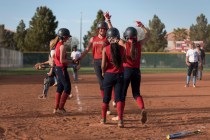 Members of the Liberty softball team celebrate a victory against Foothill at Liberty High Sc ...