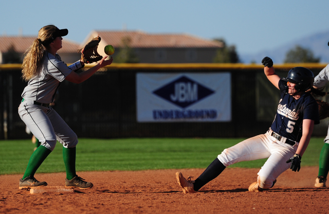 Palo Verde shortstop Lauryn Barker attempts to turn a double play while Centennial base runn ...