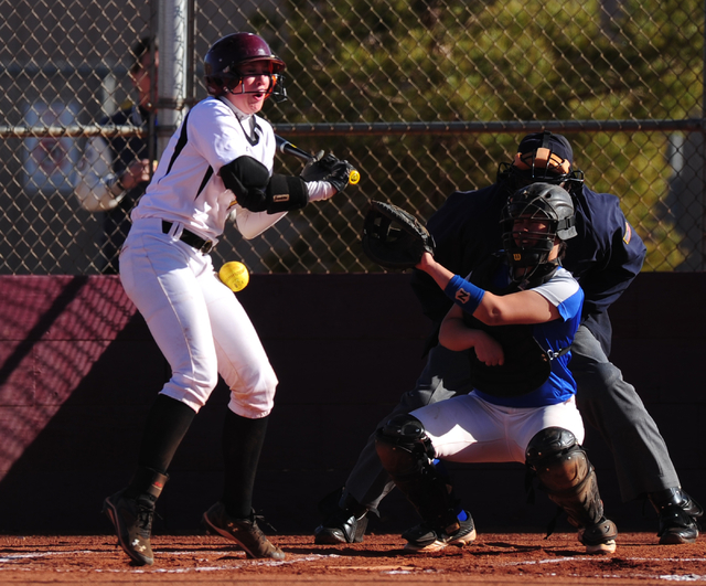 Faith Lutheran batter Samantha Jack is hit by a pitch against Sierra Vista during their prep ...