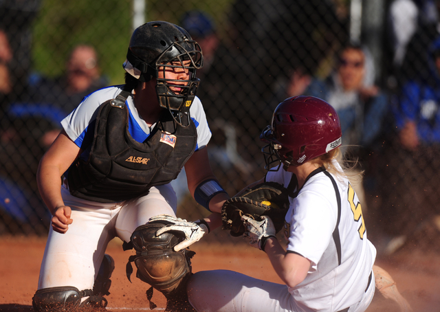 Faith Lutheran base runner Mosie Foley (5) scores the game’s tying run ahead of the ta ...