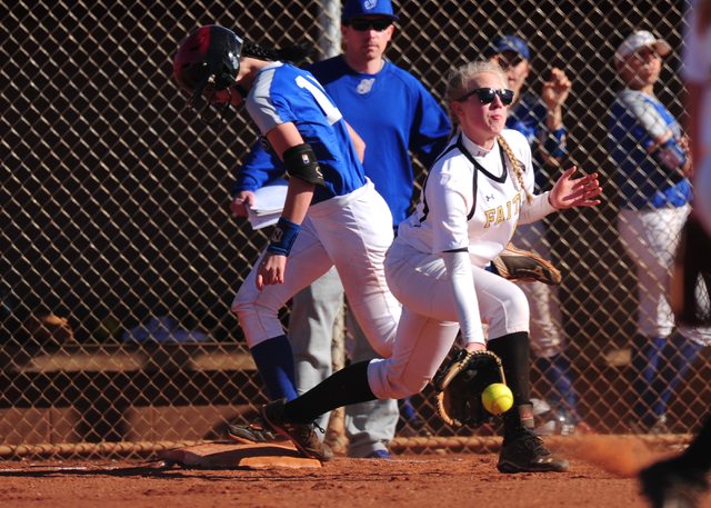 Sierra Vista base runner Daelynn Hilton beats the throw fielded by Faith Lutheran first base ...