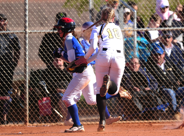 Faith Lutheran first baseman Samantha Jack (10) tags out Sierra Vista base runner Jamie Kala ...