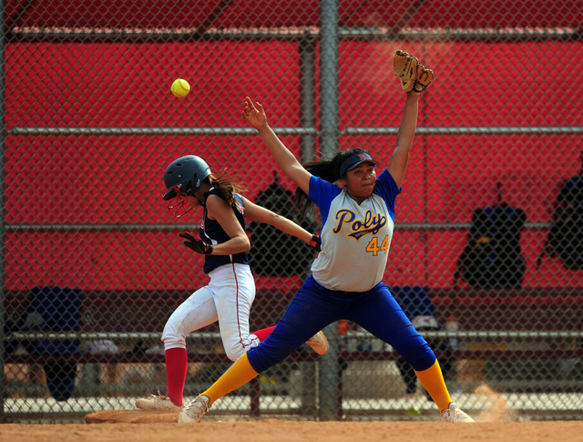 Poly (Calif.) first baseman Emily Rodriguez is unable to catch a high throw at first base wh ...