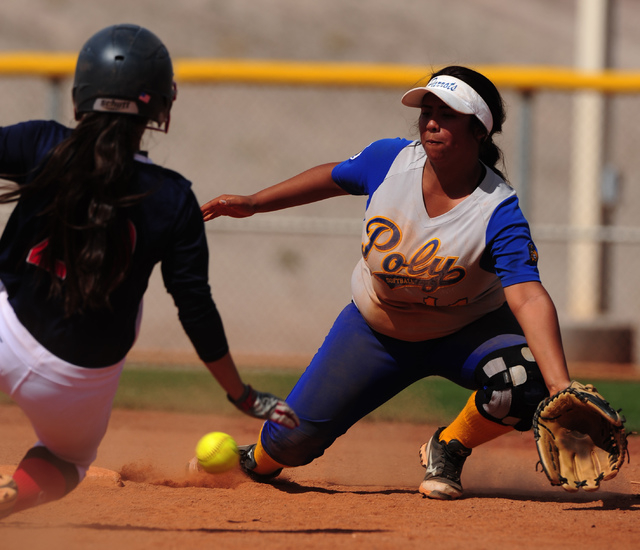 Poly (Calif.) second baseman Liliana Estrada fields an off-target throw while Liberty base r ...