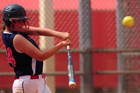 Liberty batter Morgan LaNeve hits an RBI double against Poly (Calif.) during their prep soft ...