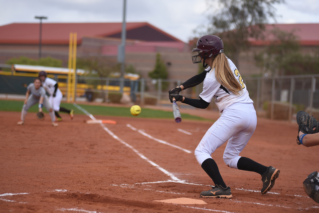 Faith Lutheran’s Ellie Fried (12) swings at a pitch against Sierra Vista during their ...