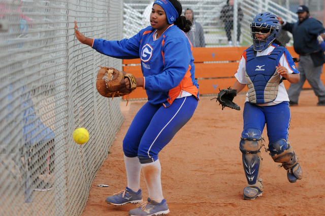Bishop Gorman first baseman Jasmine Gibson, left, and catcher Megan Coyle run to try to catc ...