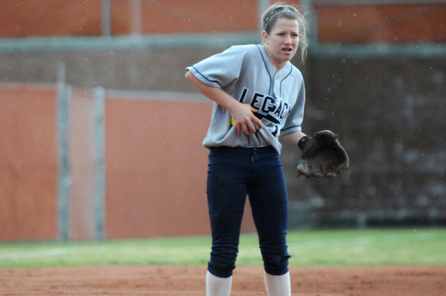 Legacy’s Kellie Nelson tries to dry off the softball as she gets ready to pitch agains ...
