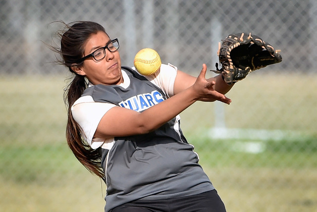 Desert Pines center fielder Maria Gaspar misses a catch during a high school softball game a ...