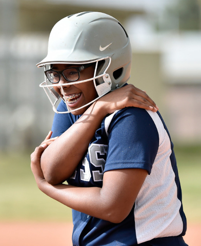 Agassi Prep’s Akiela Smith smiles as she rubs her shoulder after being hit with the ba ...