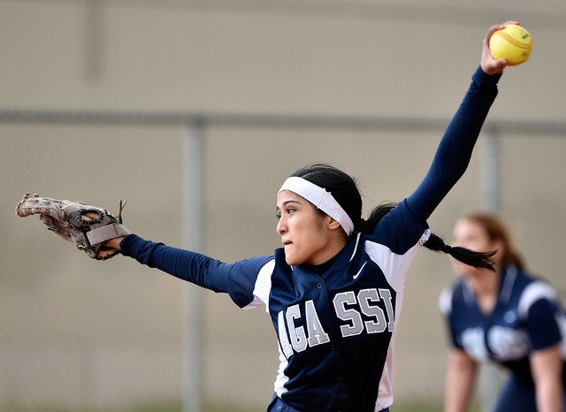Agassi Prep pitcher Felicia Hernandez winds up to pitch the ball during a high school softba ...