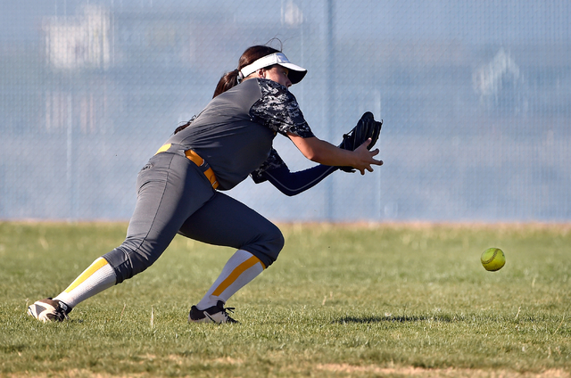 Boulder City outfielder Jeanne Carmell misses a fly ball during a high school softball game ...