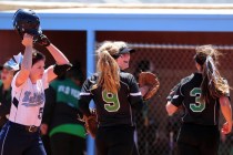 Palo Verde players celebrate after catching the game ending pop fly ball hit by Centennial b ...