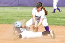 Foothill’s Katelyn Enzweiler slides head first at second as Silverado’s Alexa Os ...