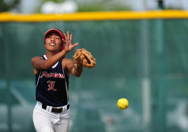 Liberty right fielder Kelsey Camat-Toki is unable to make a catch on a Rancho fly ball in th ...