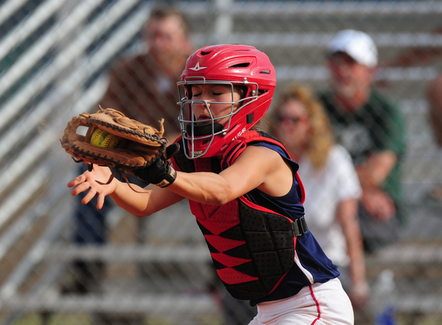 Liberty catcher McKenna Hefley fields a throw to force out a Rancho runner at home plate in ...