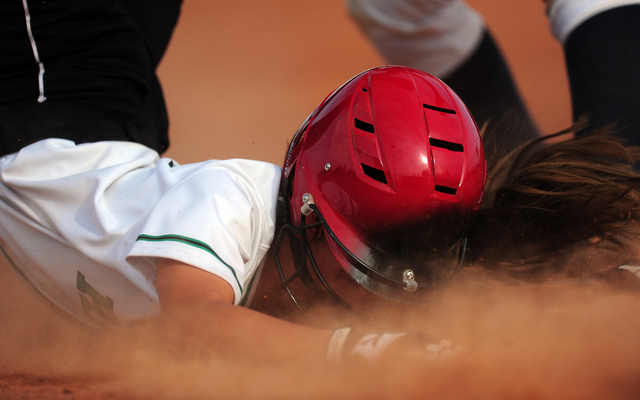 Rancho base runner Lorena DeLaTorre is tagged out by Liberty third baseman Breanna Alvarez a ...