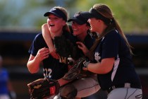 Spring Valley’s Mariah Ward, middle, and Stephanie Huff, right, congratulate starting ...