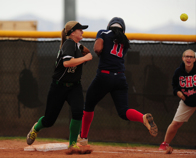 Coronado baserunner Jaiden Johnson (11) is called out for interfering with Palo Verde first ...