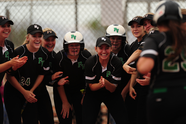 Palo Verde teammates greet Grace Chavez, far right, at home plate after she hit a home run a ...