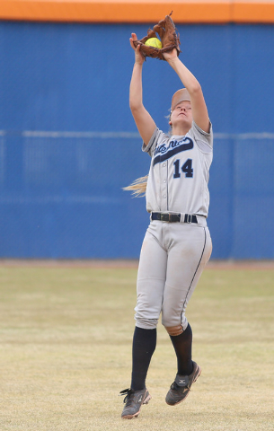 Centennial shortstop Heather Bowen makes a catch during the sixth inning of a softball game ...