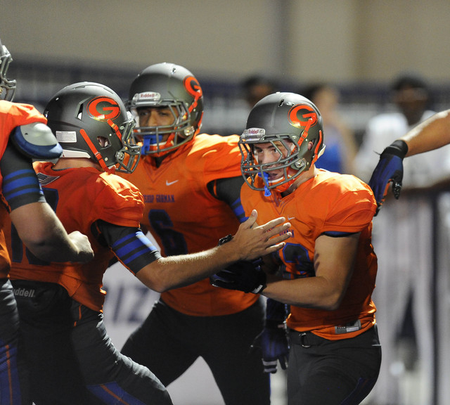 Bishop Gorman’s Jonathan Shumaker is congratulated by teammates after scoring one of h ...