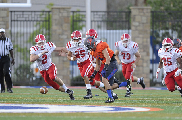 Bishop Gorman’s Nicco Fertitta recovers a Brophy Prep fumble on the opening drive of t ...