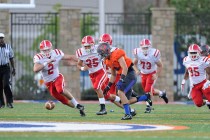 Bishop Gorman’s Nicco Fertitta recovers a Brophy Prep fumble on the opening drive of t ...