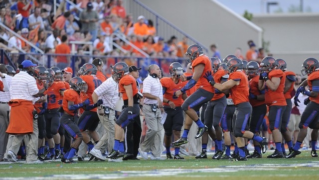 Bishop Gorman players celebrate recovering a Brophy Prep fumble in front of head coach Tony ...