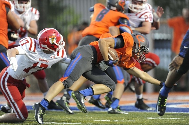 Bishop Gorman’s Biaggio Walsh scores a touchdown against Brophy Prep in the first half ...