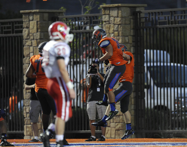 Bishop Gorman’s Alec Lazarou, left, celebrates with Jonathan Shumaker, right, after Sh ...